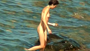 Tall Brunette Poses Naked In The Sea